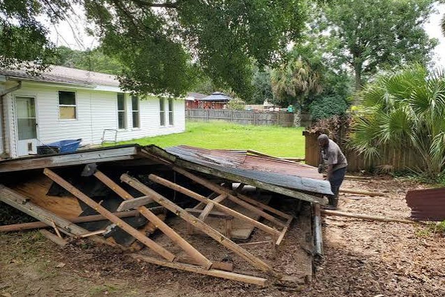 Backyard deck torn down and stacked for haul-away by Haul and Go